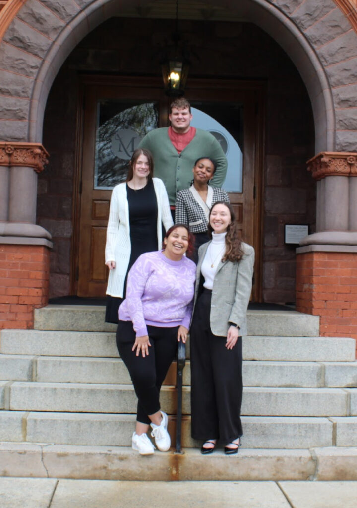 Members together on stairs