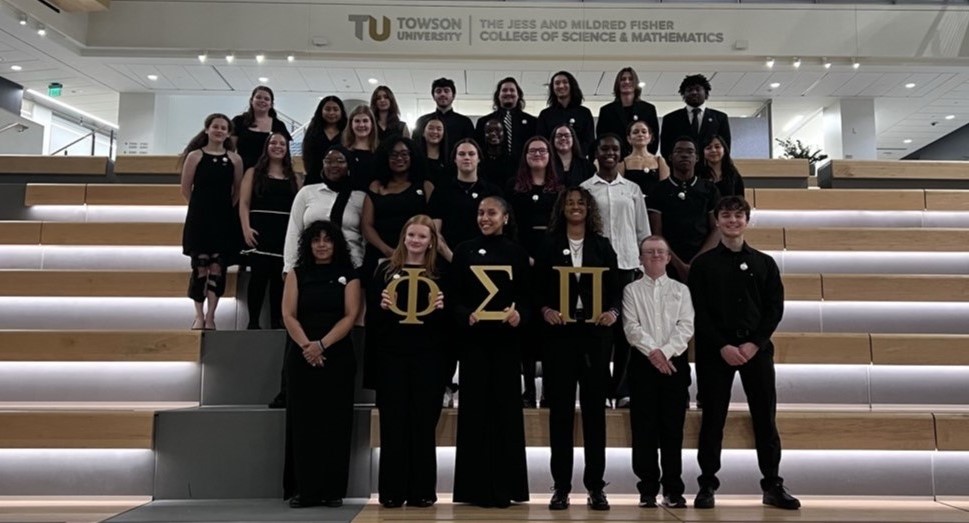 Gamma Pi Members posing together with PSP letters