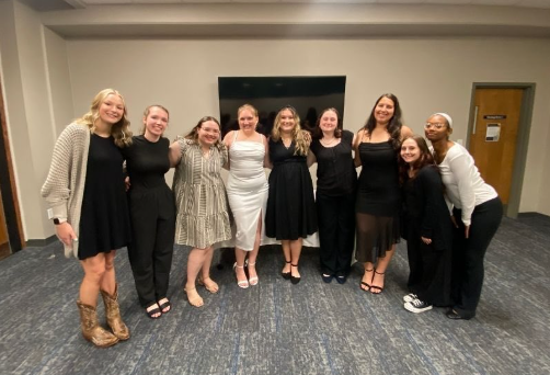 Epsilon Xi Members standing together